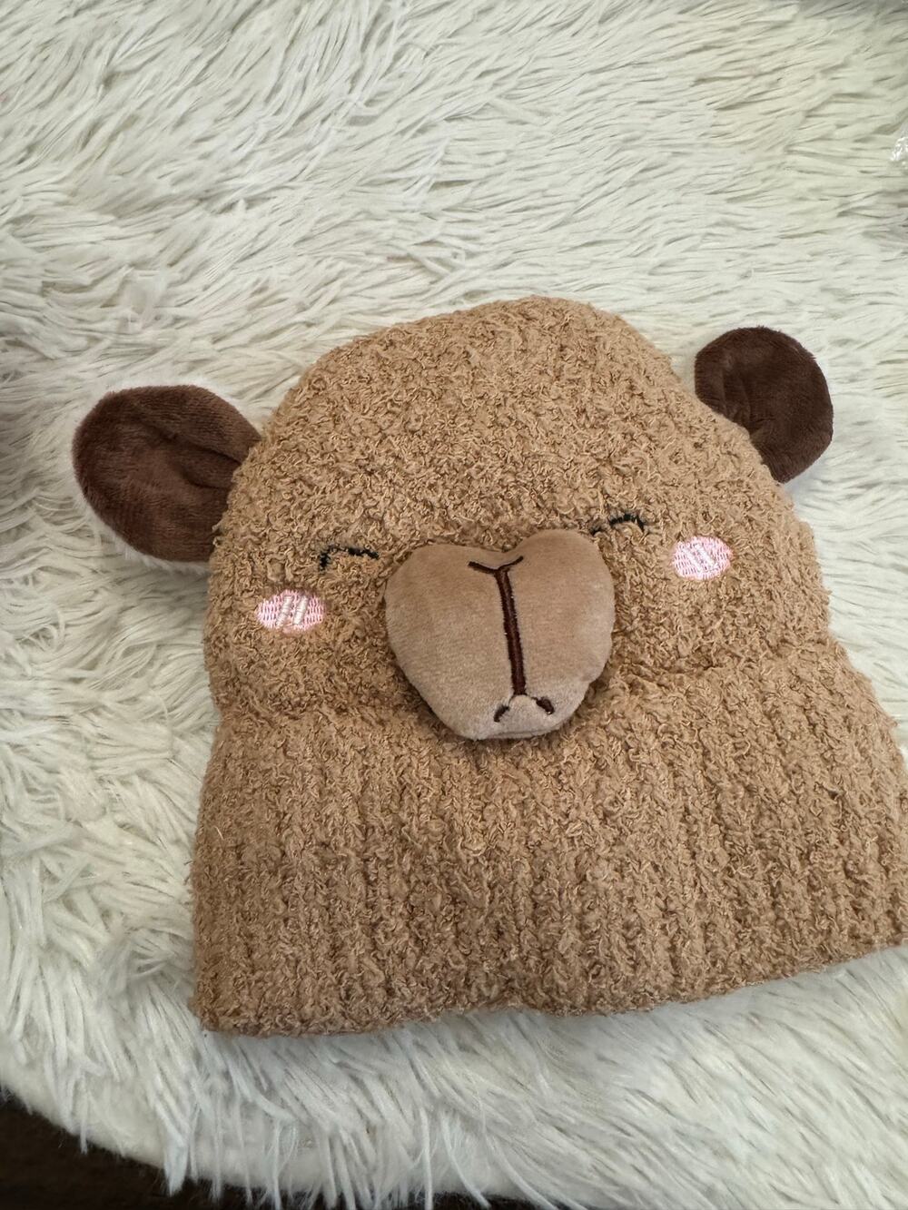 Brown knitted llama hat with embroidered face and ears and fuzzy linen for kids